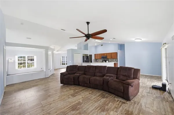 a living room with furniture and a large window