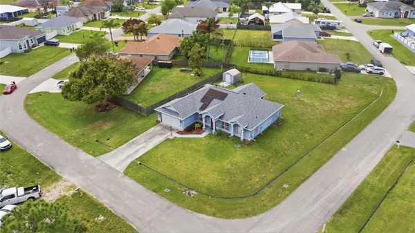 an aerial view of a house with swimming pool