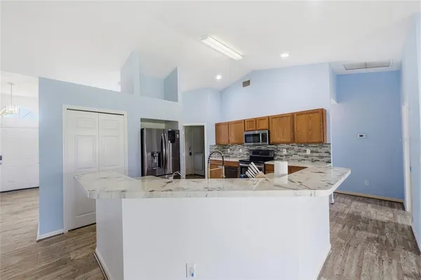 a view of living room with furniture and flat screen tv