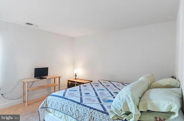 a bedroom with a bed and tv