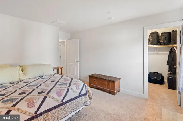 a bedroom with a bed and a lamp