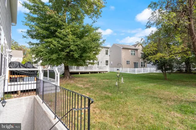 a view of a swimming pool with a house