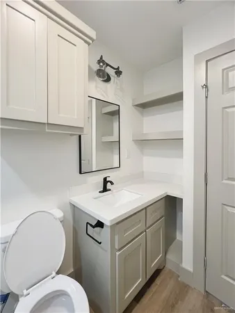 a view of a house with wooden fence