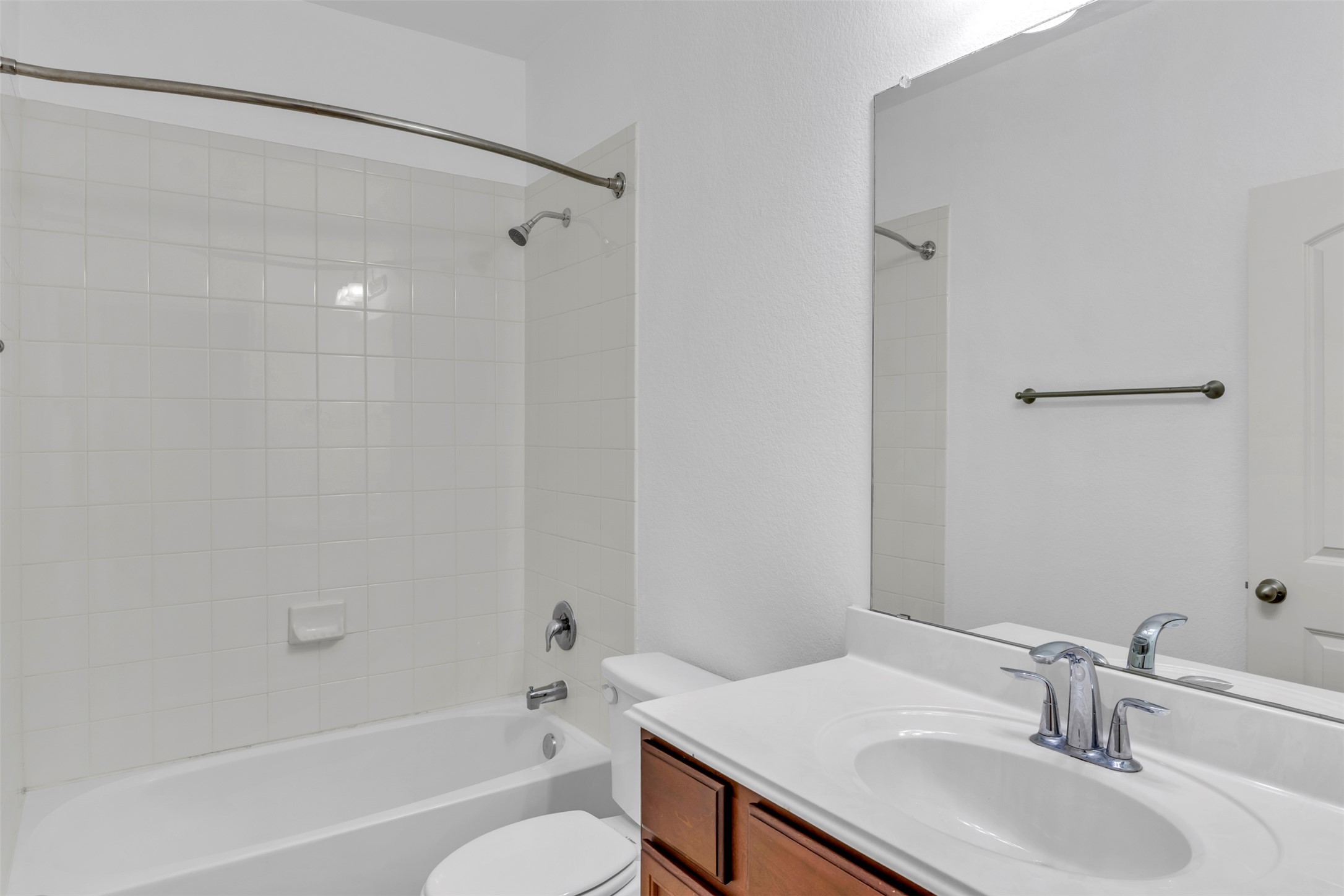 13213 Clara Martin Road Manor, TX 78653 - Photo 11 of 38 Bathroom featuring vanity and shower / tub combination