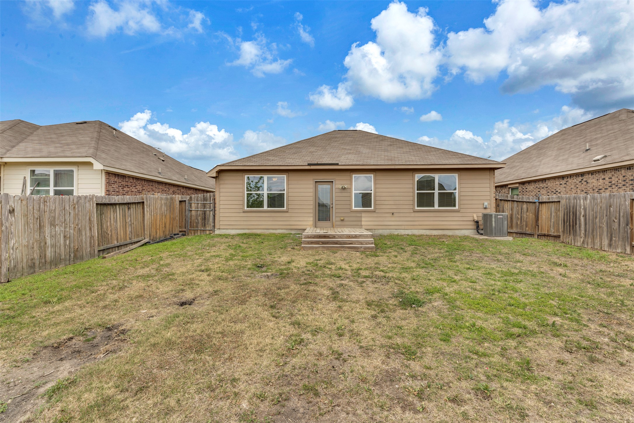 13213 Clara Martin Road Manor, TX 78653 - Photo 28 of 38 Back of property with a fenced backyard