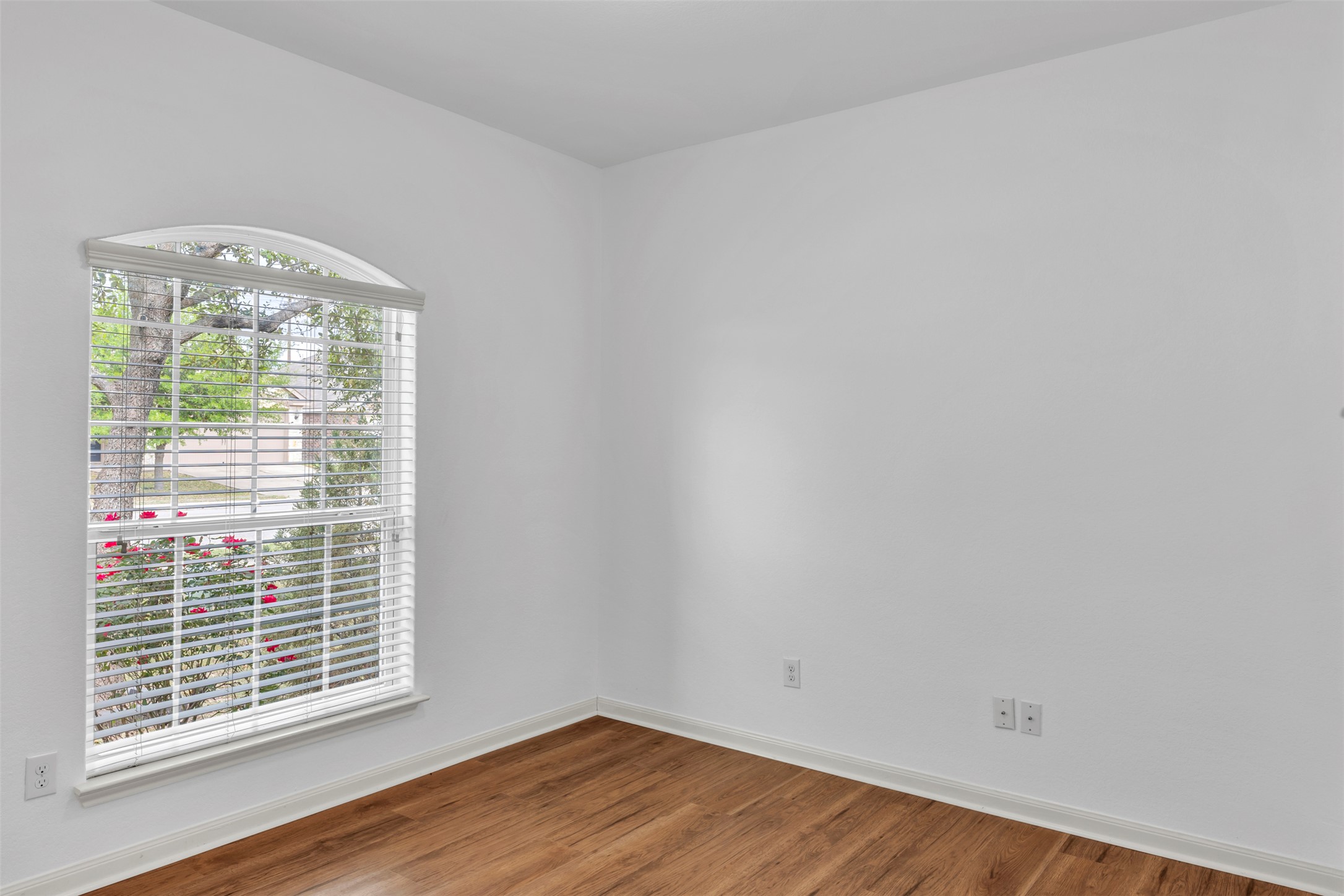 13213 Clara Martin Road Manor, TX 78653 - Photo 7 of 38 Unfurnished room featuring baseboards and wood finished floors
