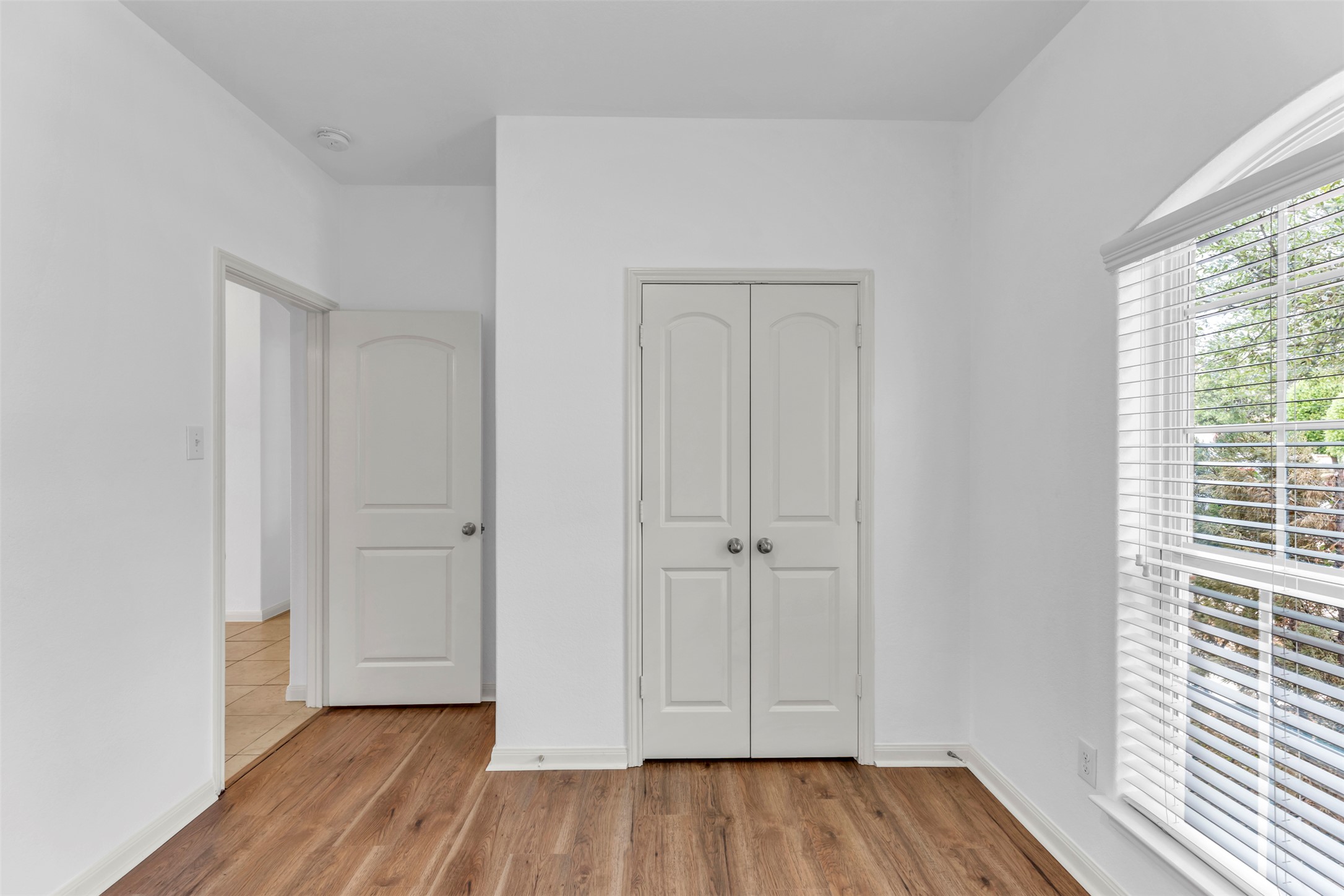 13213 Clara Martin Road Manor, TX 78653 - Photo 8 of 38 Unfurnished bedroom with a closet and light wood-style flooring