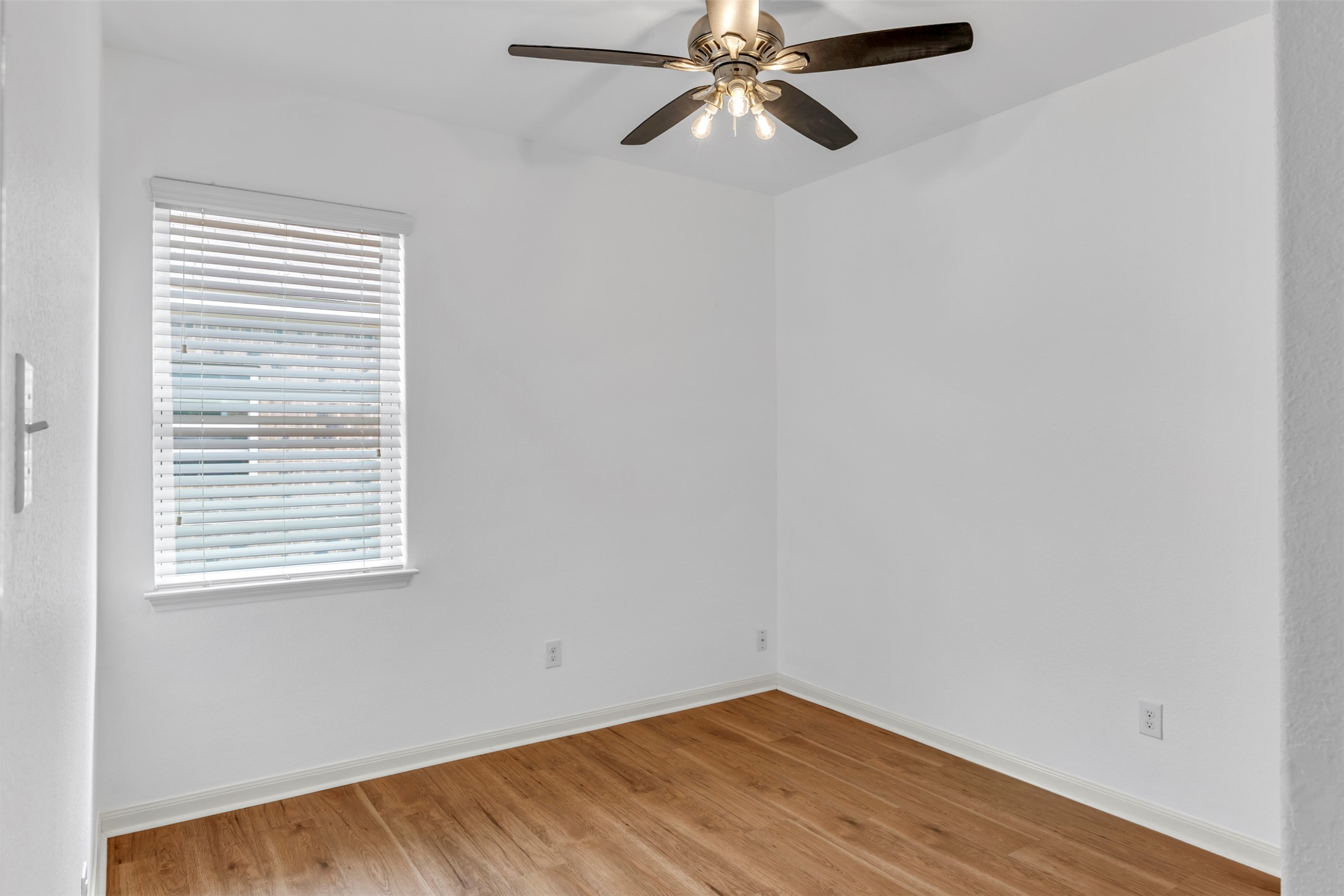 13213 Clara Martin Road Manor, TX 78653 - Photo 9 of 38 Spare room featuring light wood-type flooring and a ceiling fan