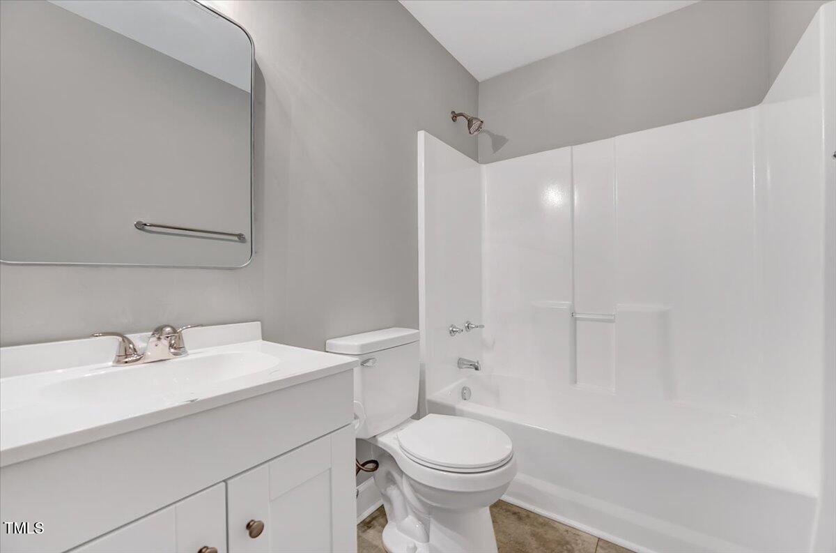 592 Perdues Road Louisburg, NC 27549 - Photo 13 of 27 a bathroom with a sink a toilet and shower