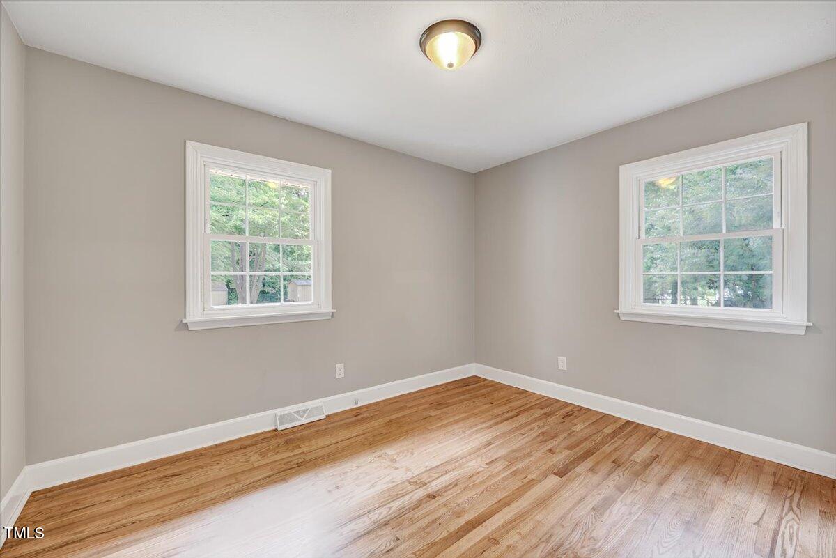 592 Perdues Road Louisburg, NC 27549 - Photo 16 of 27 a view of a room with wooden floor and window