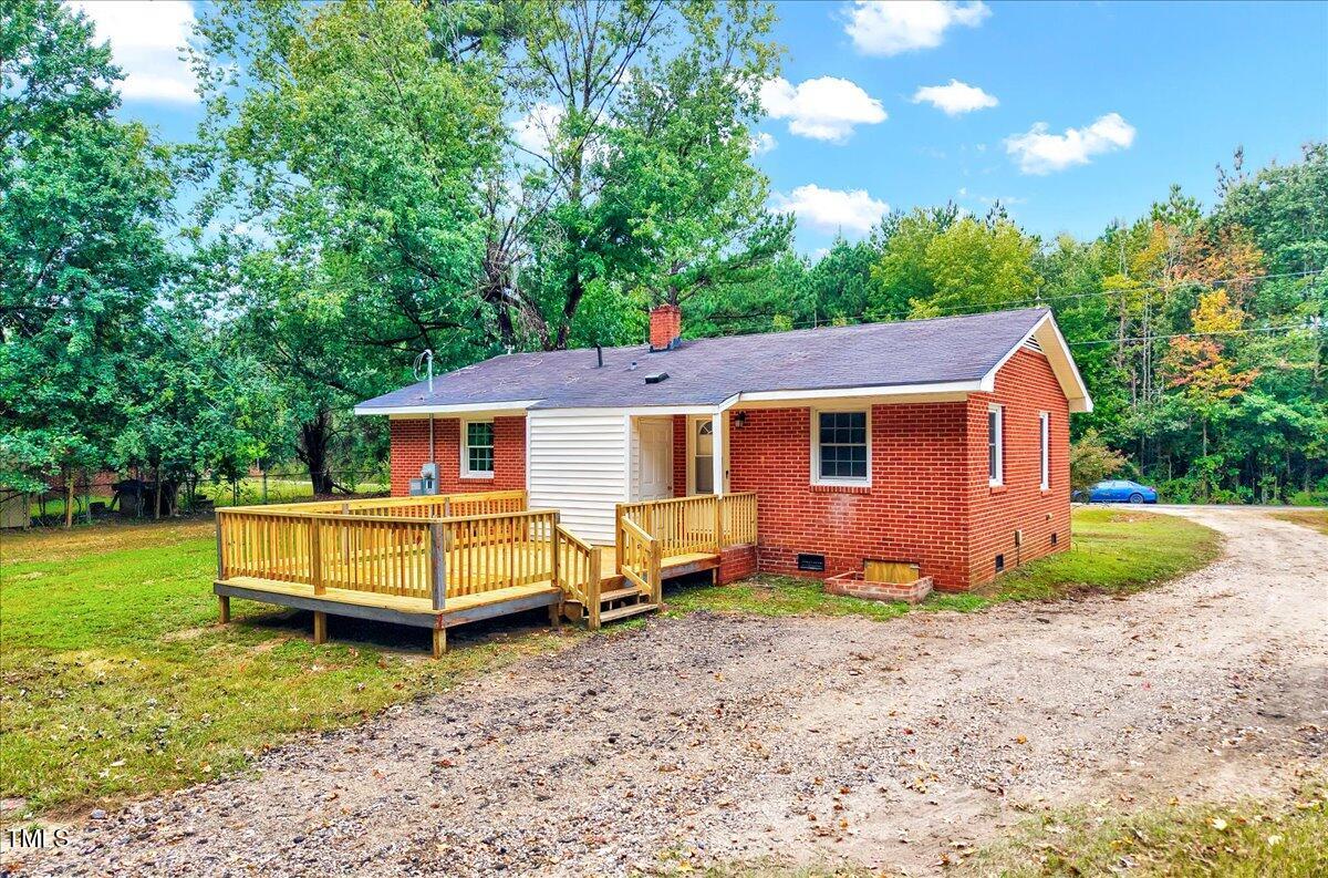 592 Perdues Road Louisburg, NC 27549 - Photo 21 of 27 a view of a house with a yard