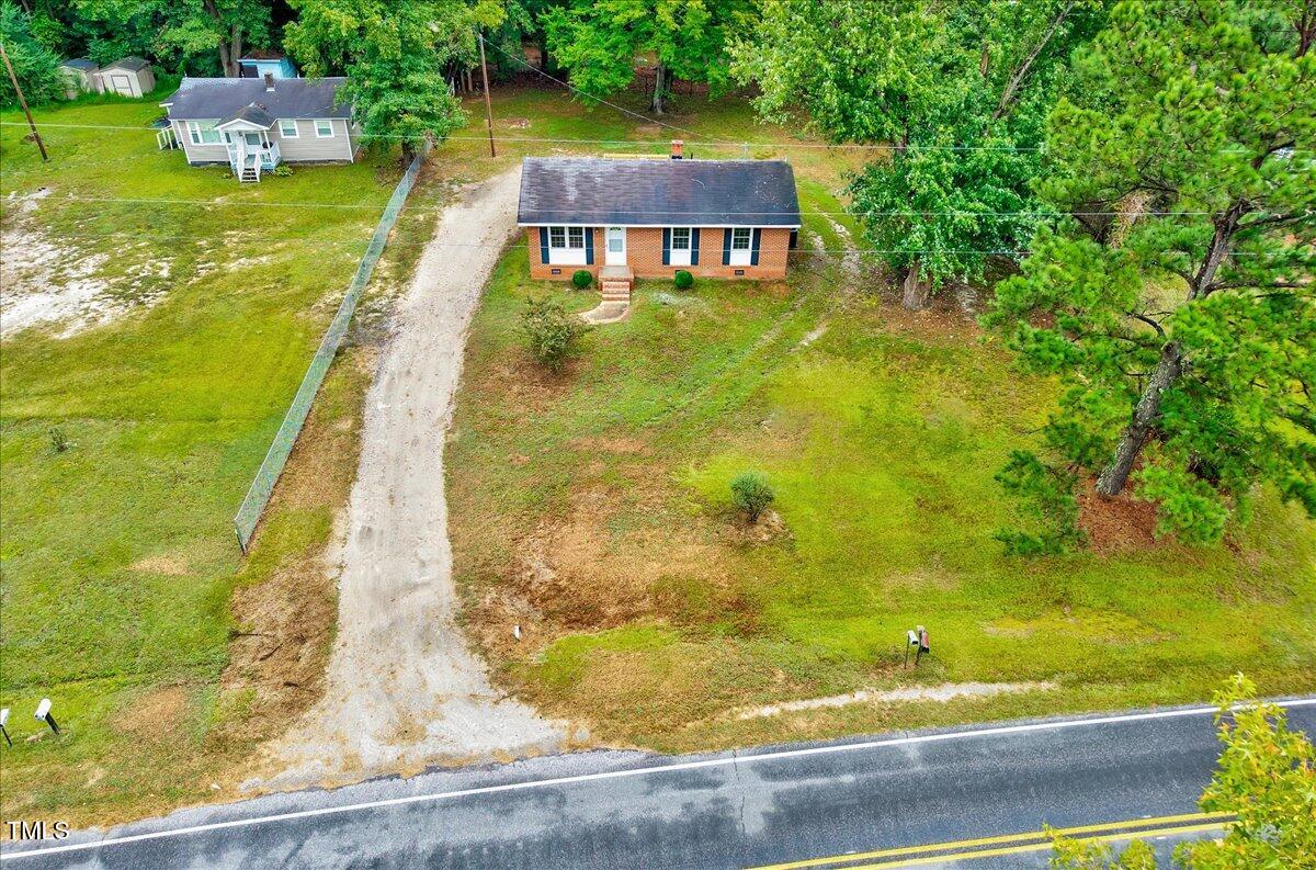 592 Perdues Road Louisburg, NC 27549 - Photo 23 of 27 a view of a swimming pool with a yard