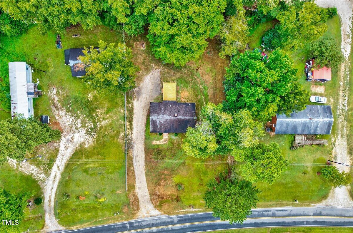 592 Perdues Road Louisburg, NC 27549 - Photo 24 of 27 a backyard of a house with lots of green space