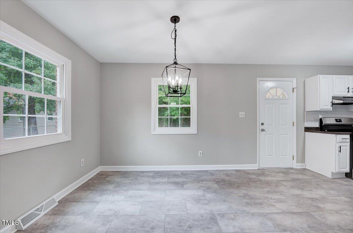 592 Perdues Road Louisburg, NC 27549 - Photo 3 of 27 a view of a room with window and entryway