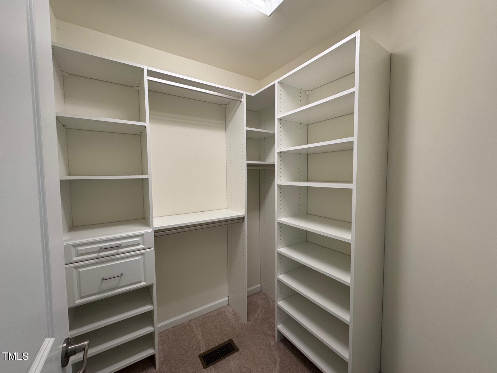 1205 Elliott Ridge Lane Morrisville, NC 27560 - Photo 11 of 32 a view of walk in closet with empty racks