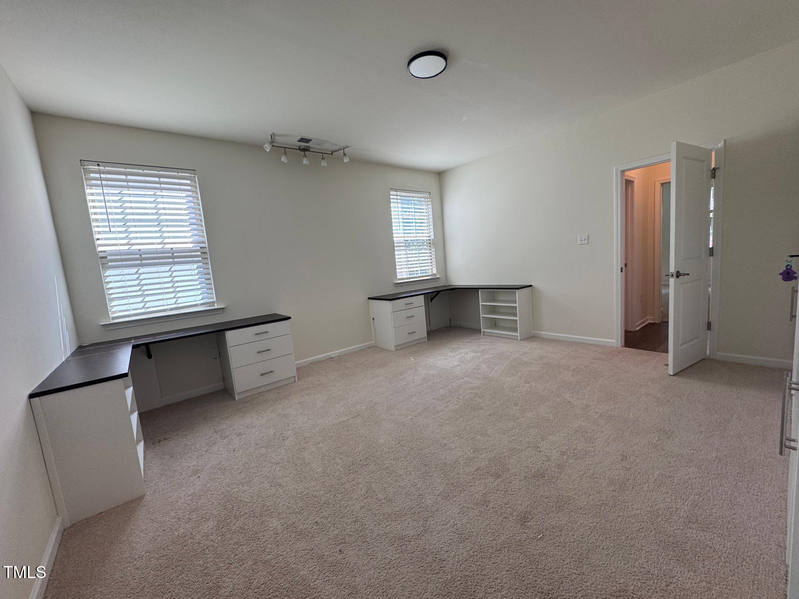1205 Elliott Ridge Lane Morrisville, NC 27560 - Photo 14 of 32 an empty room with windows