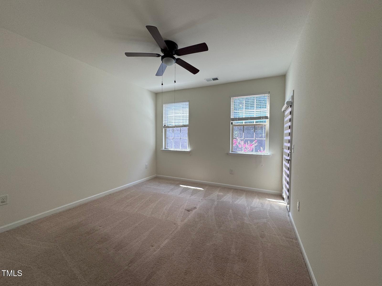 1205 Elliott Ridge Lane Morrisville, NC 27560 - Photo 20 of 32 a view of an empty room with a window