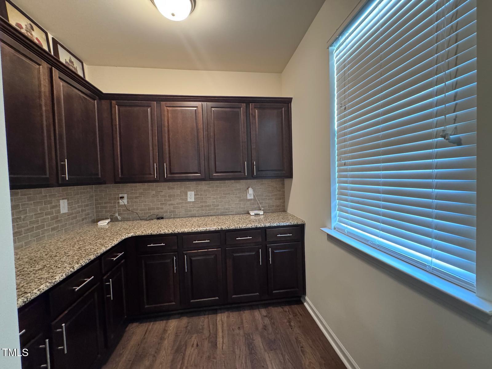 1205 Elliott Ridge Lane Morrisville, NC 27560 - Photo 22 of 32 a kitchen with a sink and cabinets