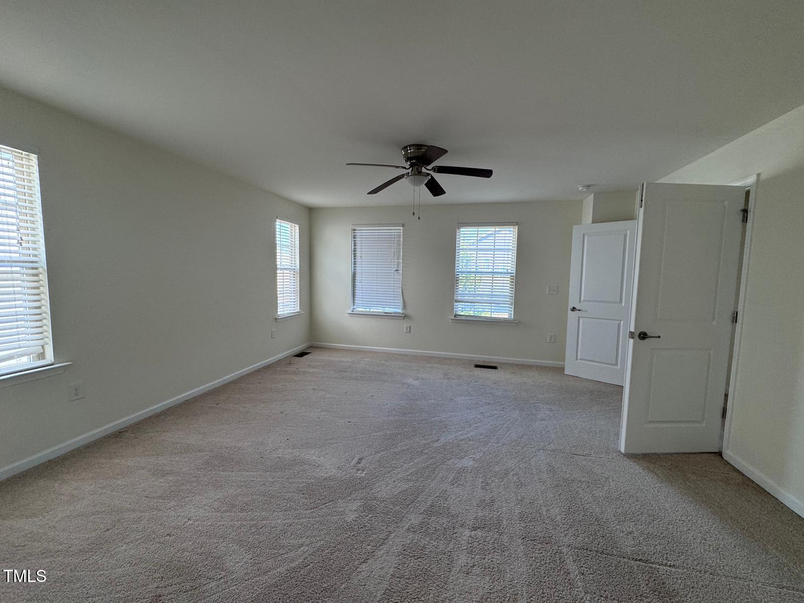 1205 Elliott Ridge Lane Morrisville, NC 27560 - Photo 30 of 32 a view of an empty room with a window