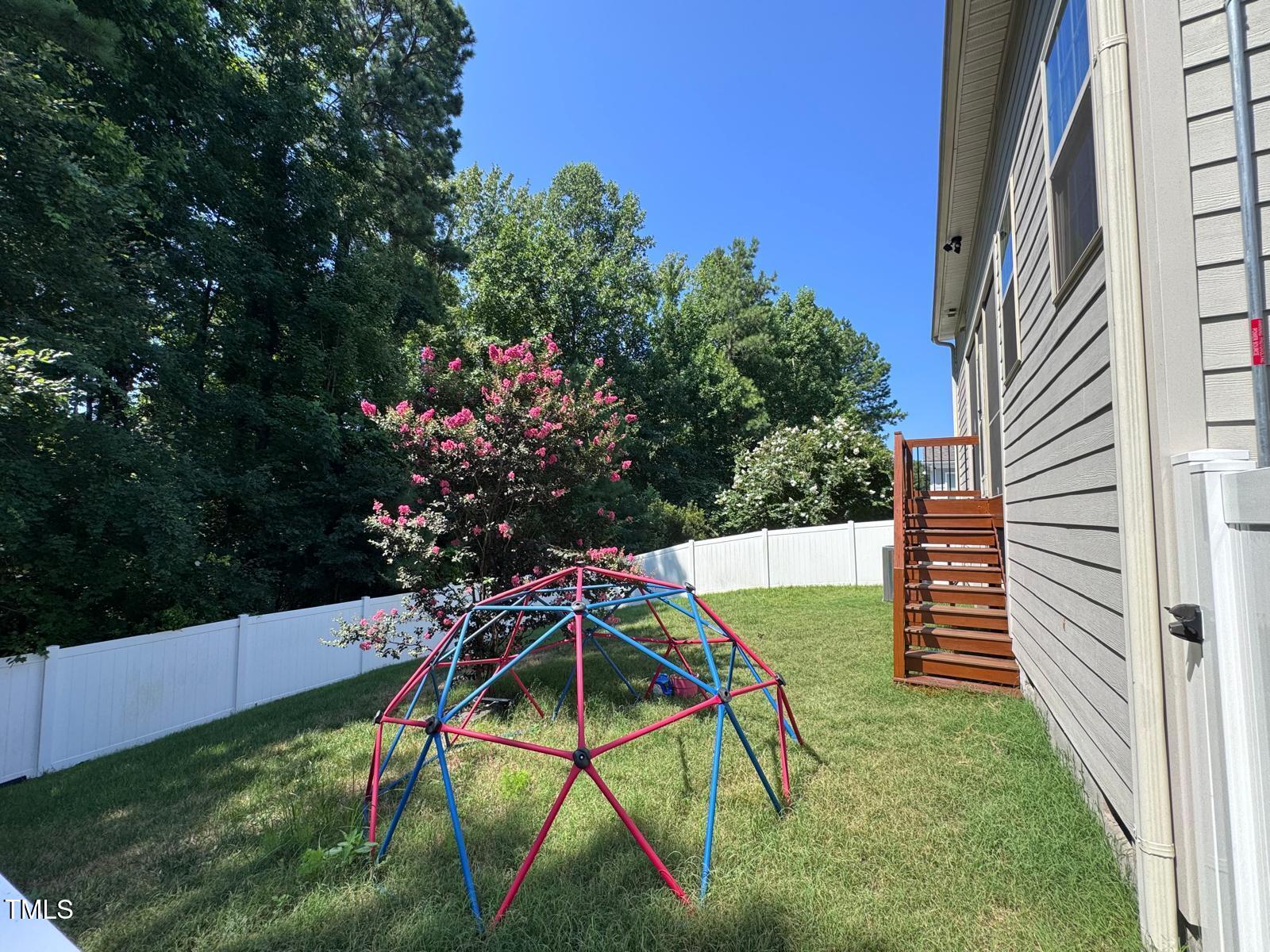 1205 Elliott Ridge Lane Morrisville, NC 27560 - Photo 31 of 32 a view of an outdoor space and deck