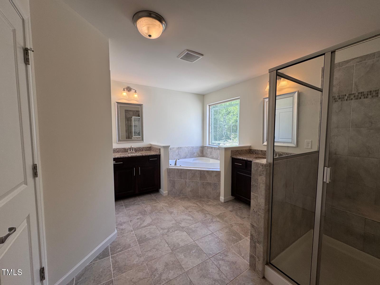 1205 Elliott Ridge Lane Morrisville, NC 27560 - Photo 6 of 32 a large bathroom with a bathtub and a sink