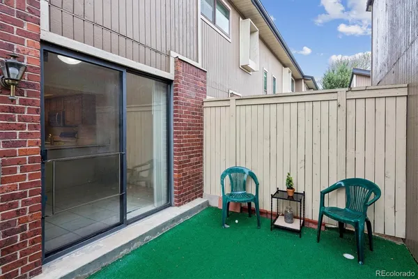 a view of a chair in backyard of house