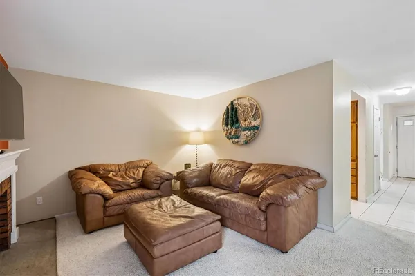 a living room with a couch and a flat screen tv