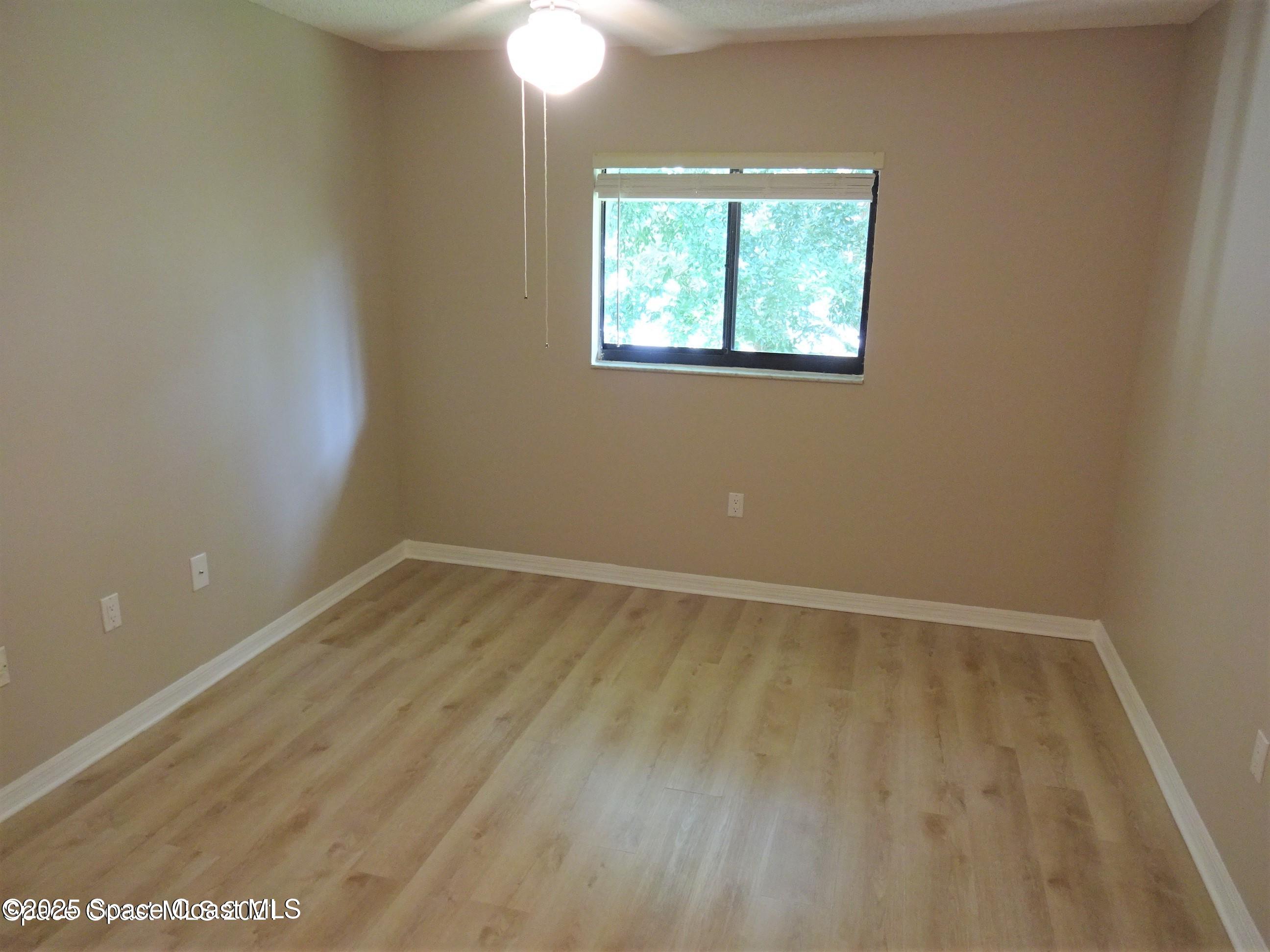 1720 Murrell Road, Unit 217 Rockledge, FL 32955 - Photo 17 of 24 an empty room with a window