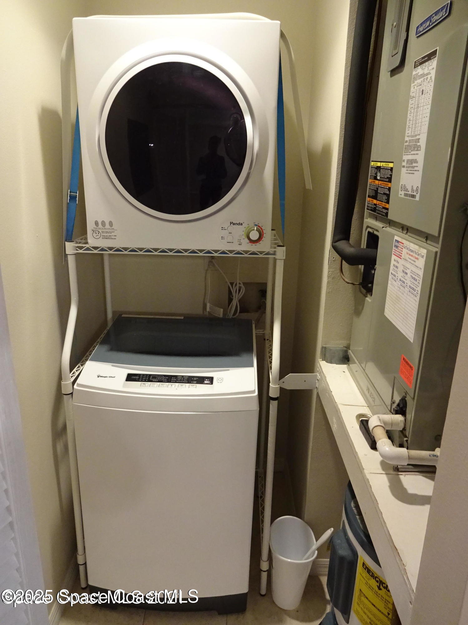 1720 Murrell Road, Unit 217 Rockledge, FL 32955 - Photo 23 of 24 a close up view of a washer and dryer