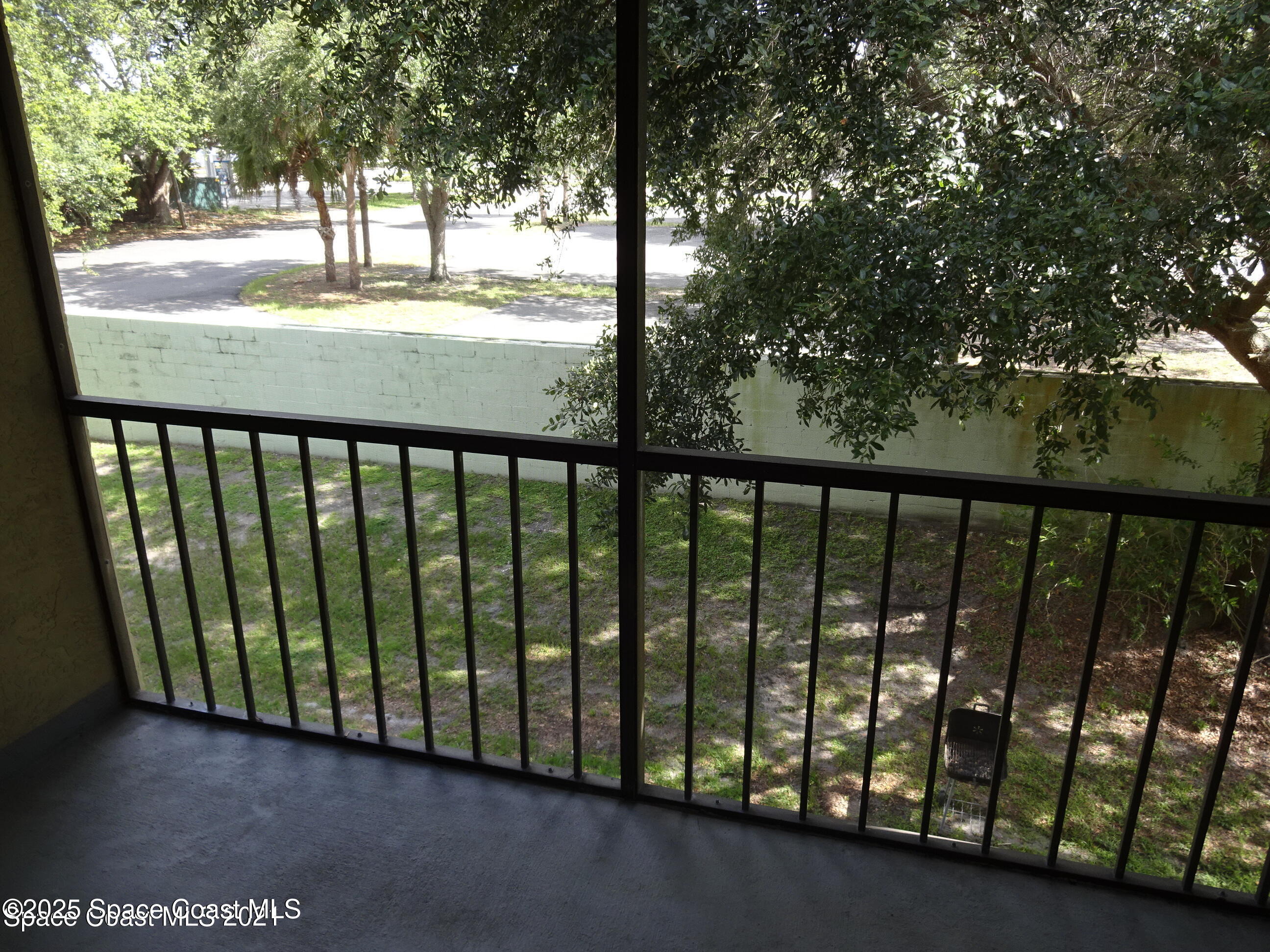 1720 Murrell Road, Unit 217 Rockledge, FL 32955 - Photo 24 of 24 a view of outdoor space with trees