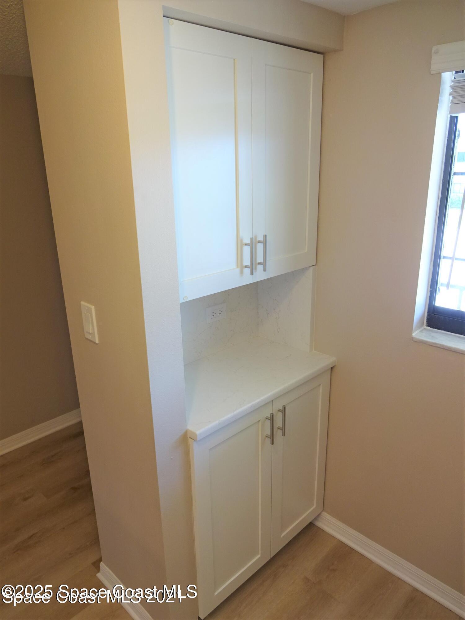 1720 Murrell Road, Unit 217 Rockledge, FL 32955 - Photo 9 of 24 a view of cabinets