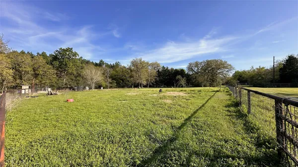 a view of a yard with an outdoor space and seating area