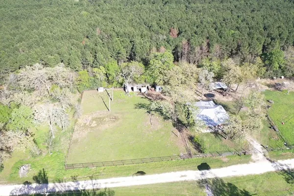 a view of yard with swimming pool