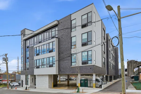 a front view of a building with street view