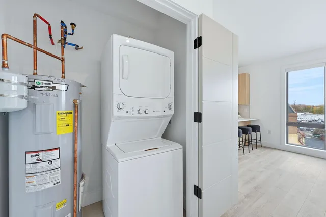 a view of hallway with washer and dryer