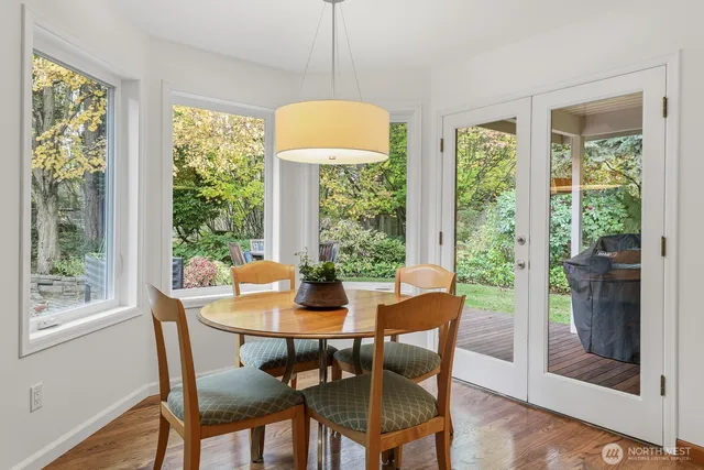 a view of a dining room with furniture and a window