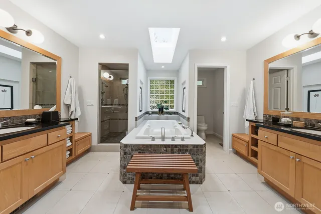 a large kitchen with kitchen island a stove a sink and a refrigerator