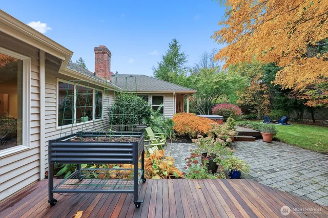 a front view of a house with garden and patio