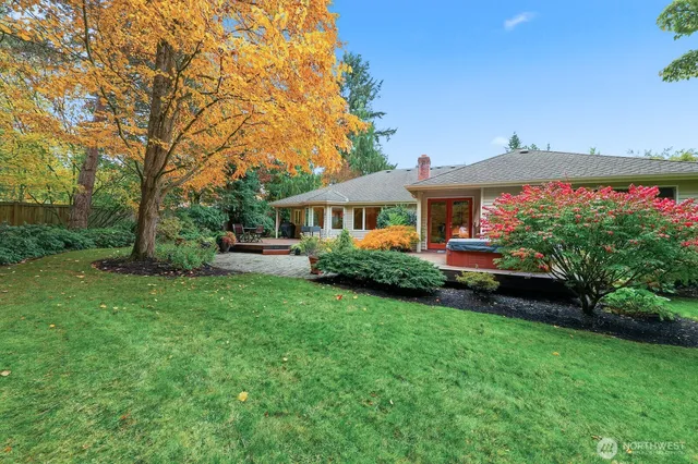 a front view of a house with a garden and deck