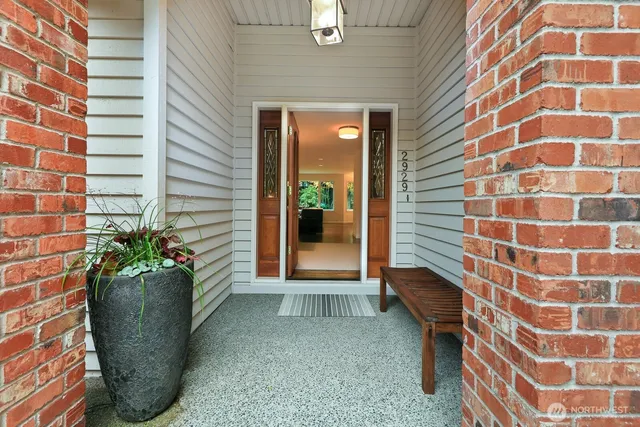 a view of a entryway with flower pots