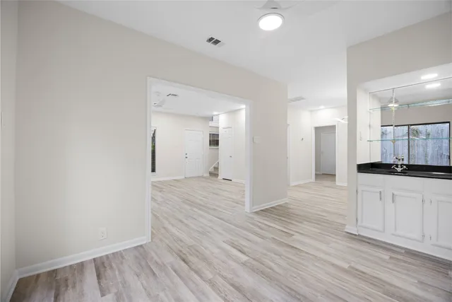 a view of a kitchen from the hallway