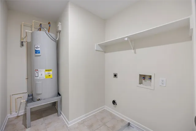 a view of storage and utility room with closet