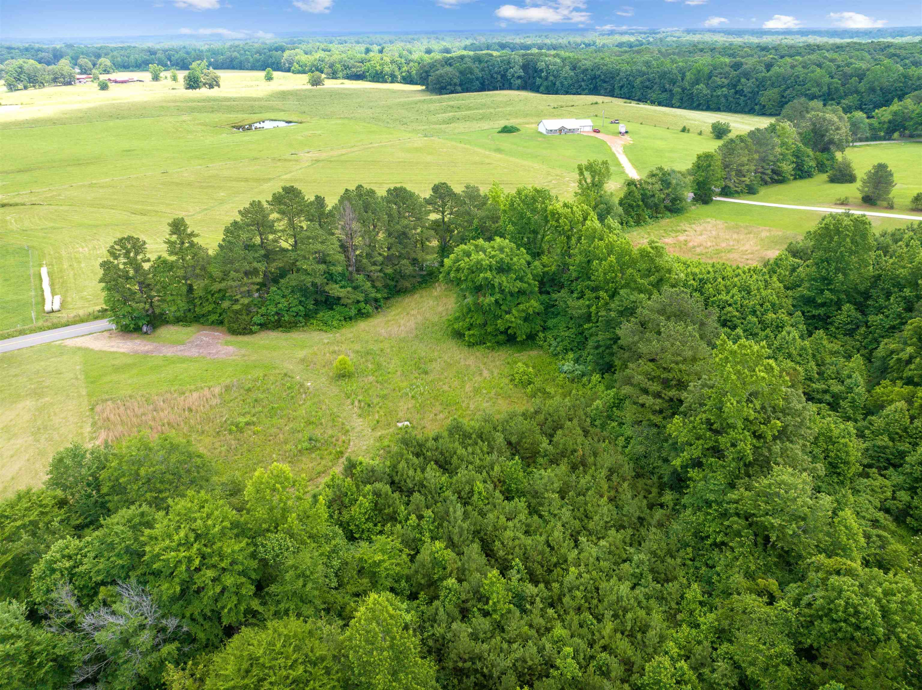 0 Wilson Road Huron, TN 38345 - Photo 13 of 14 a view of an ocean and a yard with wooden fence