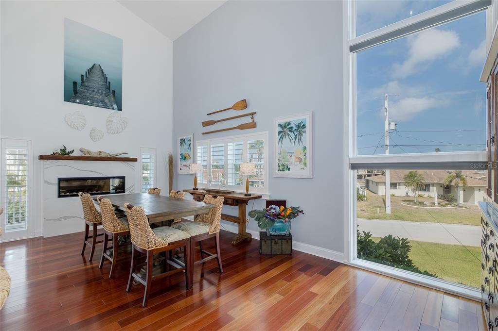 5040 Waterside Drive Port Richey, FL 34668 - Photo 14 of 58 a view of a dining room with furniture window and wooden floor