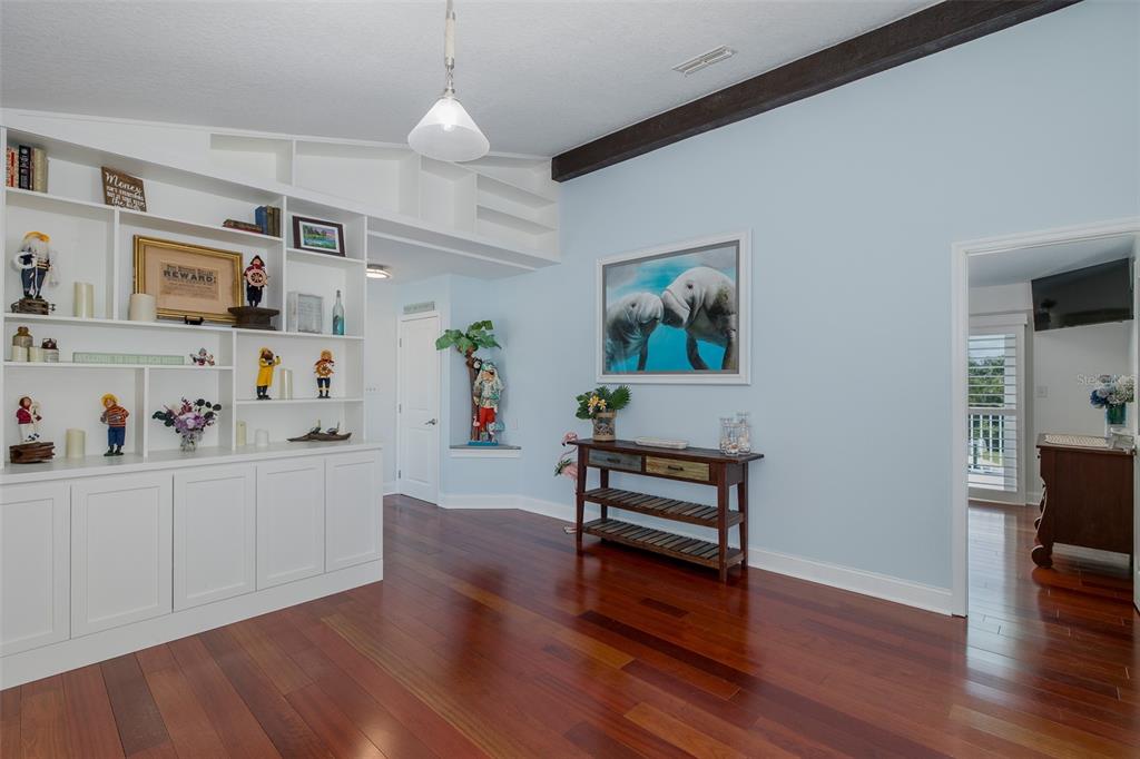 5040 Waterside Drive Port Richey, FL 34668 - Photo 16 of 58 a living room with furniture and wooden floor