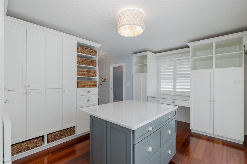 5040 Waterside Drive Port Richey, FL 34668 - Photo 20 of 58 a kitchen with a sink cabinets and wooden floor