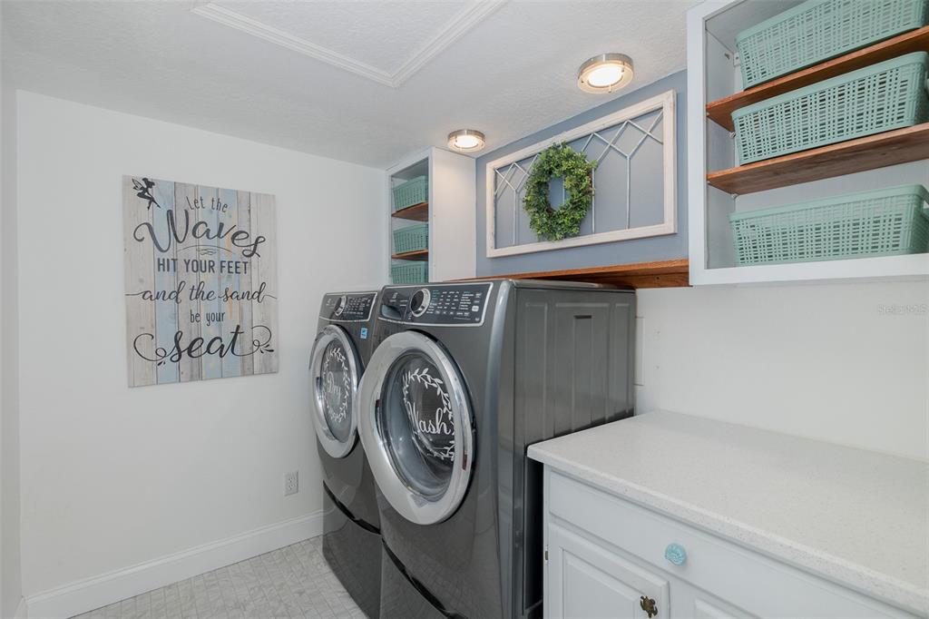5040 Waterside Drive Port Richey, FL 34668 - Photo 30 of 58 a utility room with dryer and washer