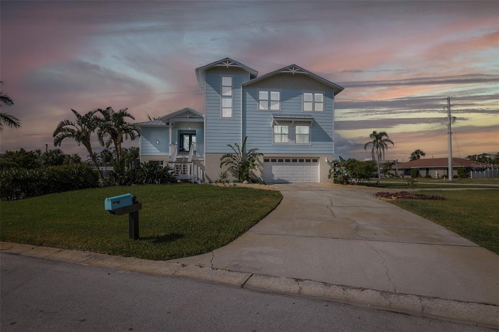 5040 Waterside Drive Port Richey, FL 34668 - Photo 3 of 58 a front view of a house with a yard