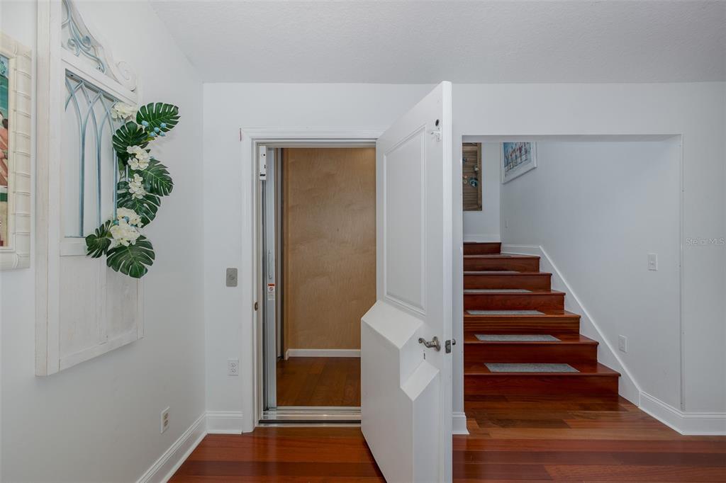 5040 Waterside Drive Port Richey, FL 34668 - Photo 31 of 58 a view of entryway with wooden floor and stairs