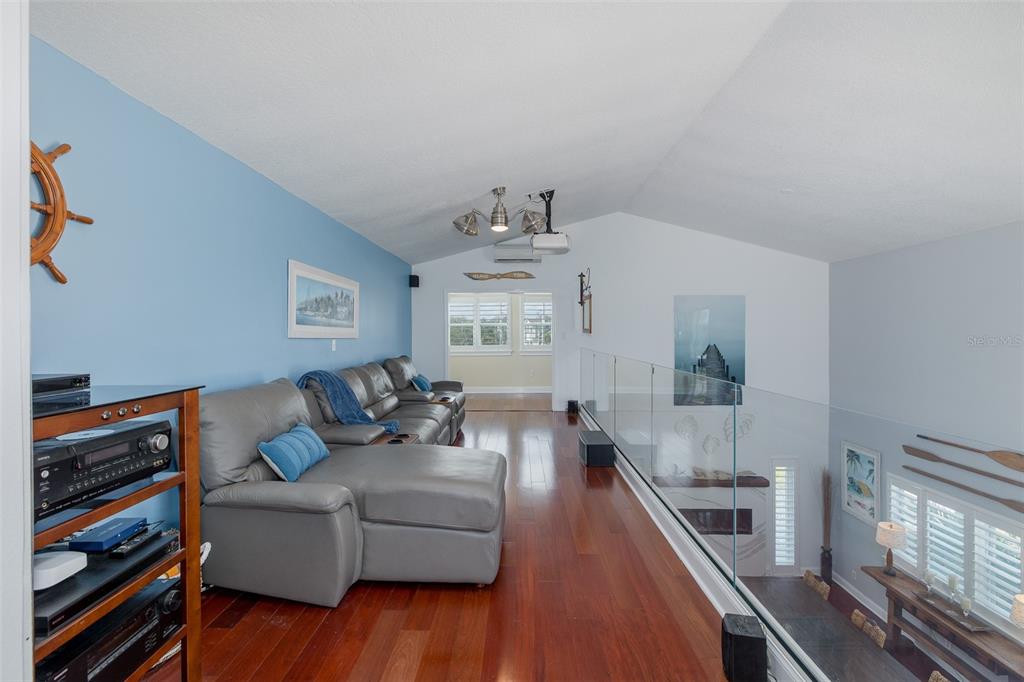 5040 Waterside Drive Port Richey, FL 34668 - Photo 35 of 58 a living room with furniture and a wooden floor